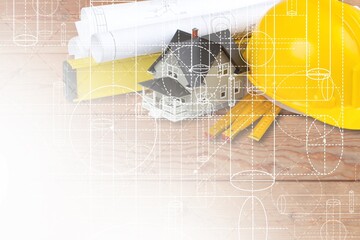 House construction architect drawing and hard hat