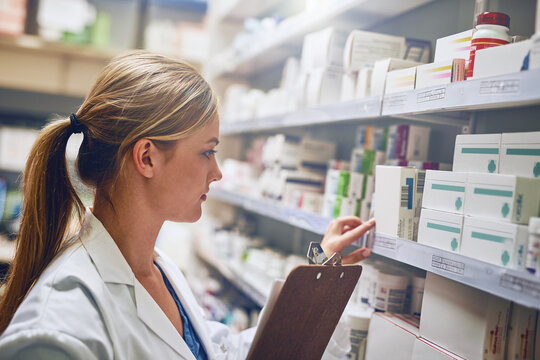 Shell change your live for the better. Shot of a pharmacist looking at medication on a shelf.