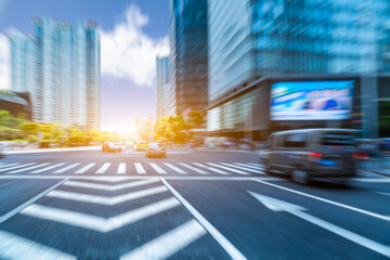 empty road with zebra crossing and skyscrapers in modern city.