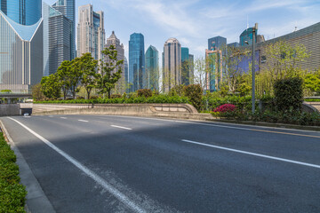 Fototapeta na wymiar cityscape and skyline of shanghai from empty asphalt road.