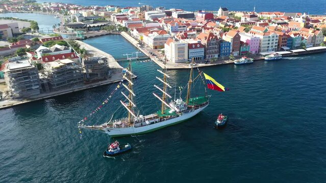 Tugboat guiding the school ship Gloria, flagship of the Colombian Navy. Willemstad. Curacao Island. July 30, 2022