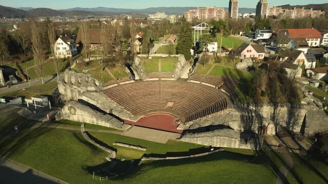 Drone panning shot of a roman theater on a sunny day close to the swiss city Basel