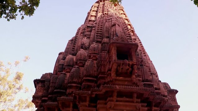 red stone ancient hindu temple architecture from unique angle at day