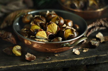 roasted chestnuts in a copper pan