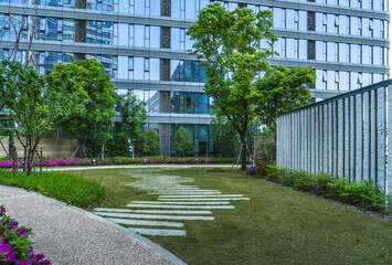 modern building and the grass in the city