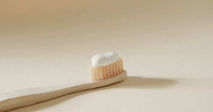 Close up of toothbrush with toothpaste on white background