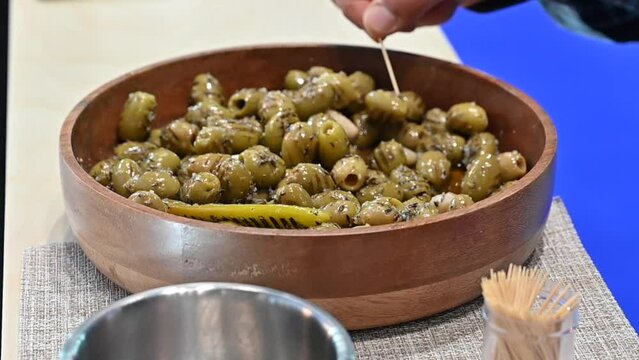 Grilled green olive pickles are displayed during the Gulf Food exhibition, United Arab Emirates