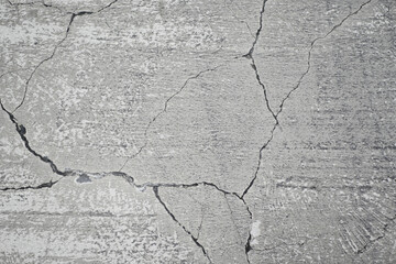 cracked asphalt after earthquake close up 