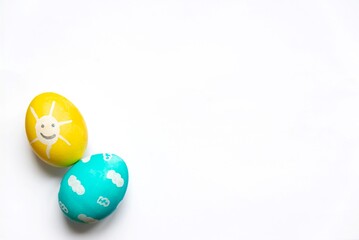 Charmingly colorfully decorated Easter eggs with child's paintings. Funny festive preoccupations