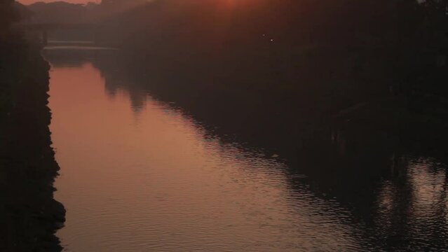 BKT sunrise golden glow river pan up