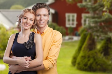 Obraz premium Happy young couple near house, lifestyle concept.
