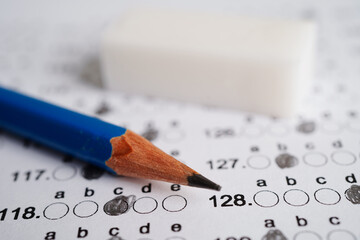Answer sheets with pencil drawing fill to select choice, education concept.