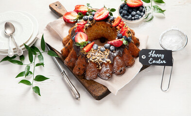 Pound Cake cake with strawberry, close-up on the table. Horizontal view from above..Pound Cake cake with mint and strawberry close-up on the table. Horizontal view from above.