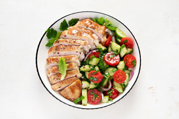Salad with chicken meat. Fresh vegetable salad with chicken breast. Meat salad with chicken fillet and fresh vegetables on plate.