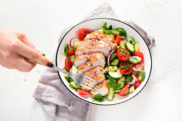 Salad with chicken meat. Fresh vegetable salad with chicken breast. Meat salad with chicken fillet and fresh vegetables on plate.