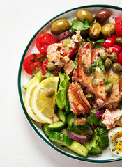 Tuna salad with lettuce, eggs and tomatoes.