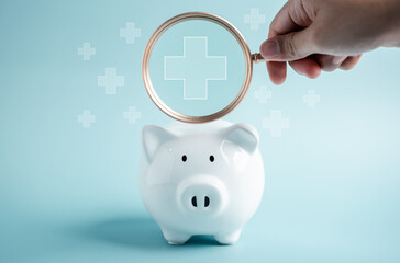 Piggy bank money health check concept. Health care financial checkup and saving for medical...
