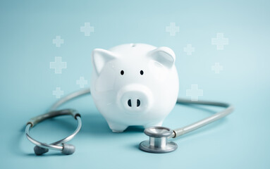 Piggy bank with stethoscope. money health check concept. Health care financial checkup and saving...