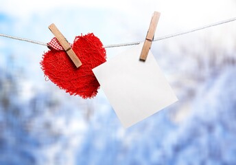 Colored lovely hearts on snowy winter background