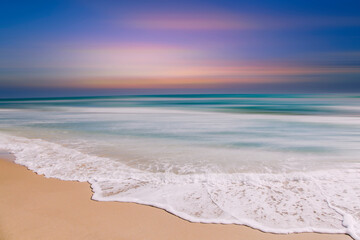 Abstract blurred defocused sunset sky and ocean nature background.