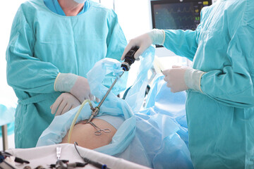 Inguinal hernia. Laparoscopic surgery.Medical instruments in the hands of doctors. Modern medicine....