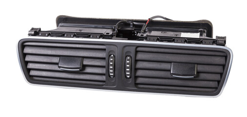A close-up view of a part of the interior of a modern car with a view of the ventilation deflector of the heater for heating and cooling the passenger compartment. Used auto part catalog from junkyard