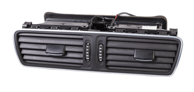 A close-up view of a part of the interior of a modern car with a view of the ventilation deflector of the heater for heating and cooling the passenger compartment. Used auto part catalog from junkyard