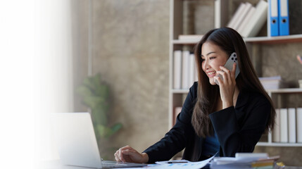 Beautiful business woman talking on the mobile phone. Management, planning and networking phone call concept