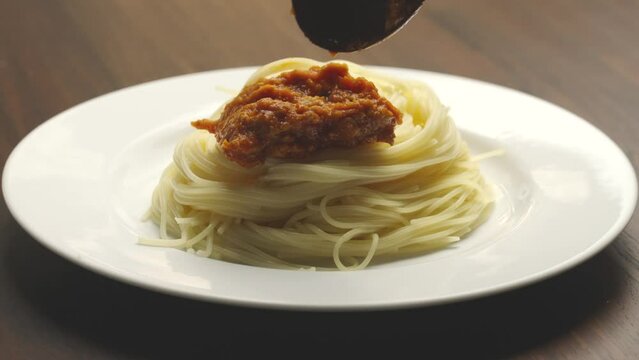 spaghetti with meatballs ingredient Italian spaghetti tomato sauce. fork eating spaghetti