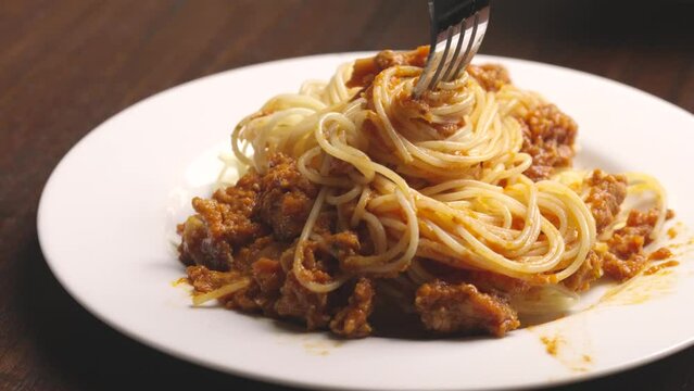 spaghetti with meatballs ingredient Italian spaghetti tomato sauce. fork eating spaghetti