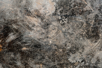 Grunge old black metal background or texture with scratches and cracks, closeup, top view