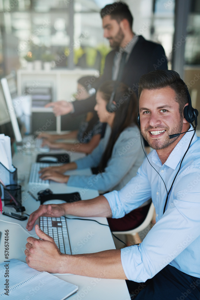 Aufkleber Support with a smile. Portrait of a happy and confident young man working in a call center.