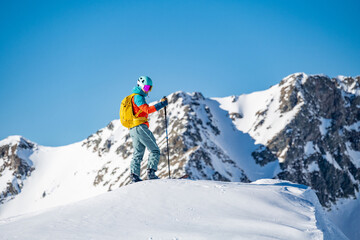 Mountaineer backcountry ski walking ski alpinist in the mountains. Ski touring in alpine landscape...