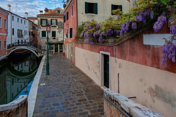 Fototapeta na wymiar Architecture of Venice, Italy. Historic houses traditional architecture on the canal in Venice.