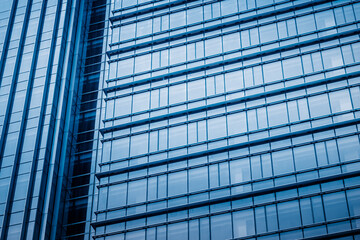 Fototapeta na wymiar Abstract building. blue glass wall of skyscraper.