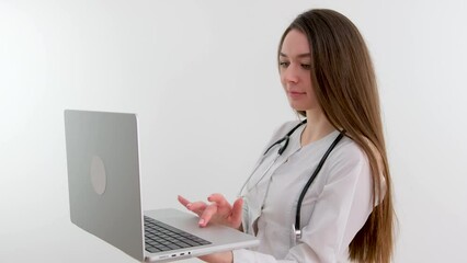 Girl doctor blond young light background studio day beautiful one positive tablet looking smiling concept of remote customer care online patients. High quality photo