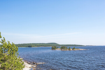 Small rock islands next to the Koyonsaari Island. Ladoga Lake. Karelia Republic landscape, Russia