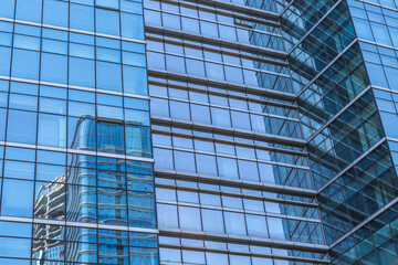 Urban abstract - windowed corner of office building.
