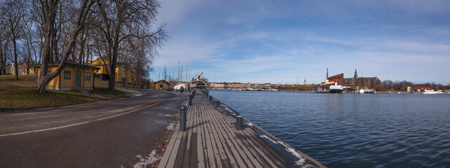 Pier view on the island Skeppsholmen and he bay Ladugårdsviken, an early spring sunny day in Stockholm