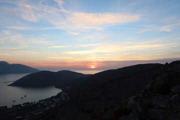 Naklejka na ściany i meble kalymnos island sunset greece europe background 