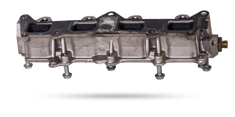 Close-up on a car fuel rail with injectors for supplying gasoline to a four cylinder engine on a white isolated background. Spare parts catalog.