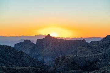 Natural sunset hills and mountains in the deep wilderness and desert of tuscon arizona in orange yellow sunset twilight