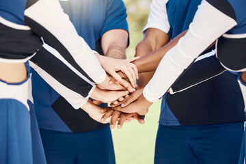 Hands, teamwork and motivation with cheerleaders in a huddle for support during a sports game or...