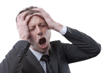 Desperate businessman with head in hands