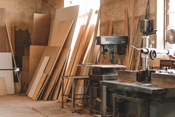 Carpentry shop interior with wood and tools - obrazy, fototapety, plakaty
