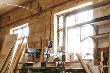 Fototapeta na wymiar Carpentry shop interior with wood and tools