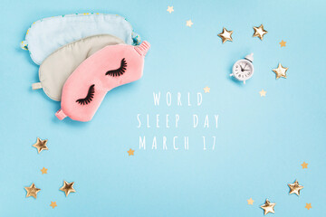 Sleeping Masks, Golden Stars and Alarm Clock on Blue Background. World Sleep Day Concept.