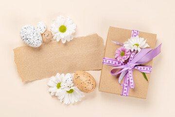 Obraz na płótnie Canvas Gift box, Easter eggs and flowers
