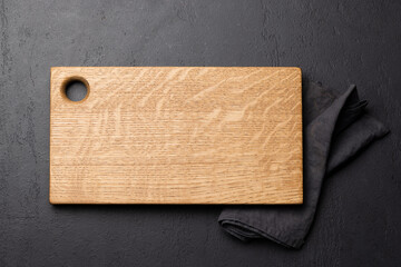 Wooden cutting board and kitchen towel