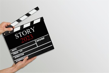 Naklejka premium Classic film slate or clapboard on background